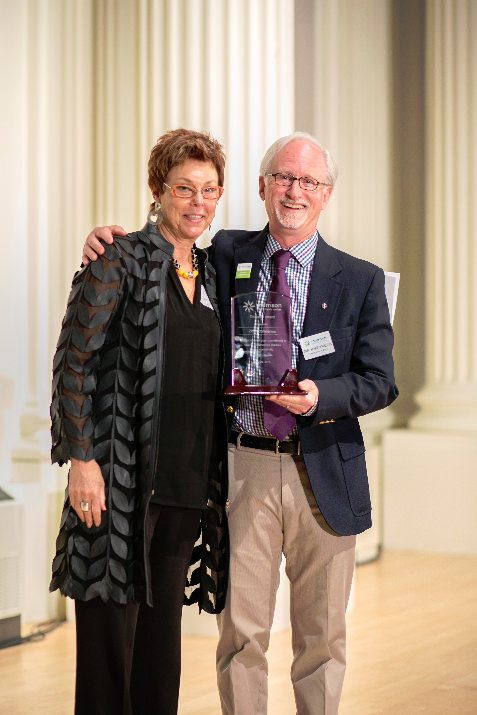 Charlene Zidell, Director of Corporate Relations and Communications, Zidell Companies accepts the Goldman Award on behalf of Zidell Companies; Drew Henrie-McWilliams, CEO Morrison Child & Family Services presents the award.