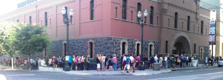 Audience members circle the block to get in for the free presentations.