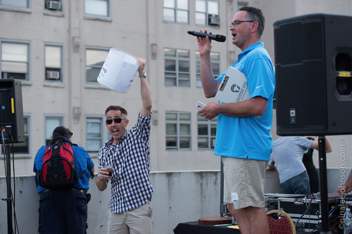 SEMpdx President, Alan George, and Events Chair, Robert Frost, announce the winner of one of the many drawings guests were able to enter at the Rooftop Networking Party including a chance to win free tickets to SearchFest 2016. (photo credit, Nina Johnson)