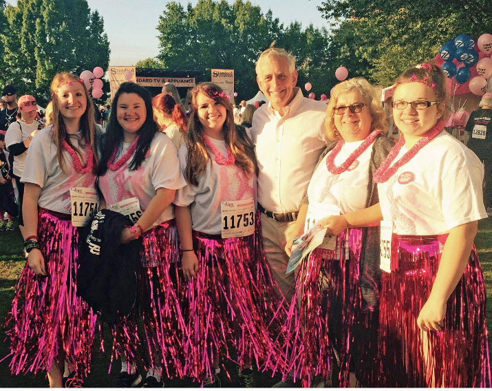 Mayor Charlie Hales gets into the spirit of the day with the Hula Girls.