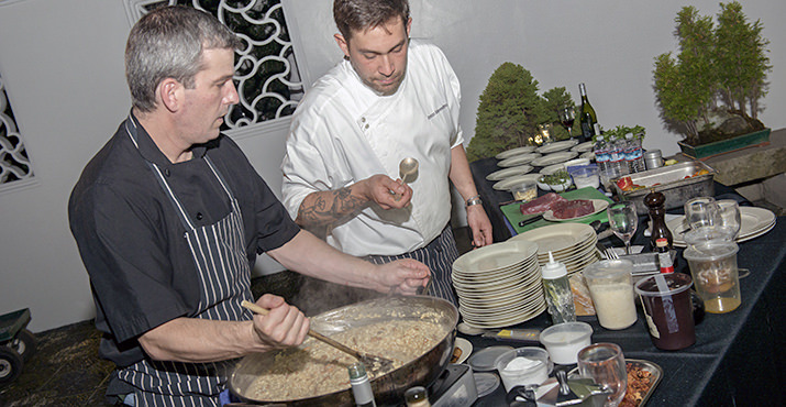 A Cena assistant chef creates risotto with Chef Enrico Merendino from A Cena Ristorante
