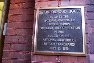 Historic plaque marks Neighborhood House’s long-standing tradition. 