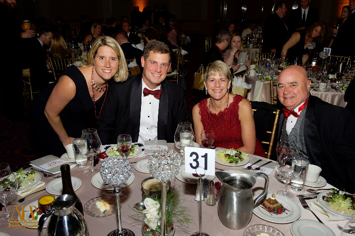 Hearts & Hands Gala Committee Member and board member Cindy Luckman (second from the right) is joined by husband Steve and Ted and Kathi Austin