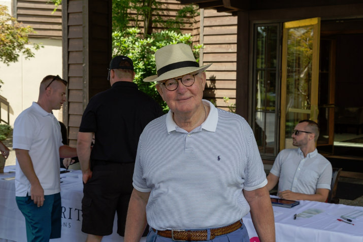 Broker Will Rader checks in before teeing off at the Windermere Stellar Golf Tournament.