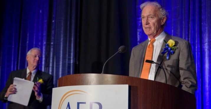 Vollum Award for Lifetime Philanthropic Achievement recipient Bill Furman accepting his award. (background: Dr. Edward J. Ray, President Oregon State University who presented the award.