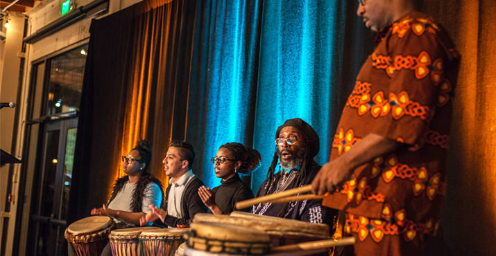 Caldera alumni with teaching artist Catón Lyles performing during the cocktail hour.