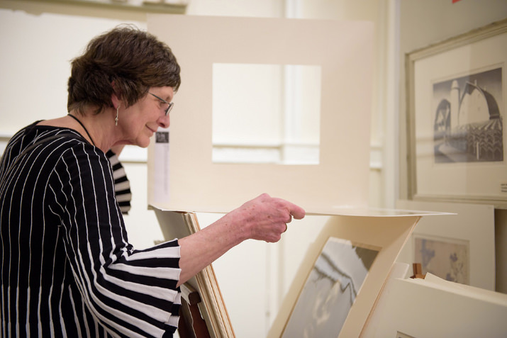 Preview benefit attendee browsing prints.