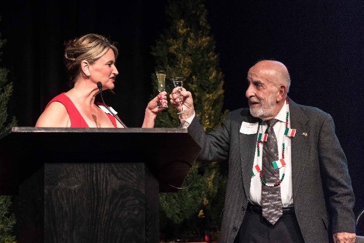 JoAnn Vance, RN, executive director of children’s developmental health, Providence Child Center toasts Heart of Gold honoree Dr. Don Romanaggi