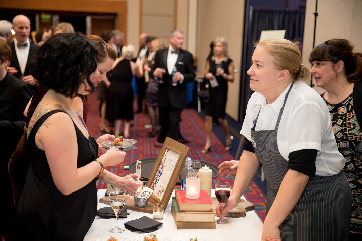 Guests enjoyed a wine and food reception before the event featuring local wine producers and gourmet bites from seven premier Portland restaurants, including Irving Street Kitchen (Executive Chef, Sarah Schafer pictured here with guest).