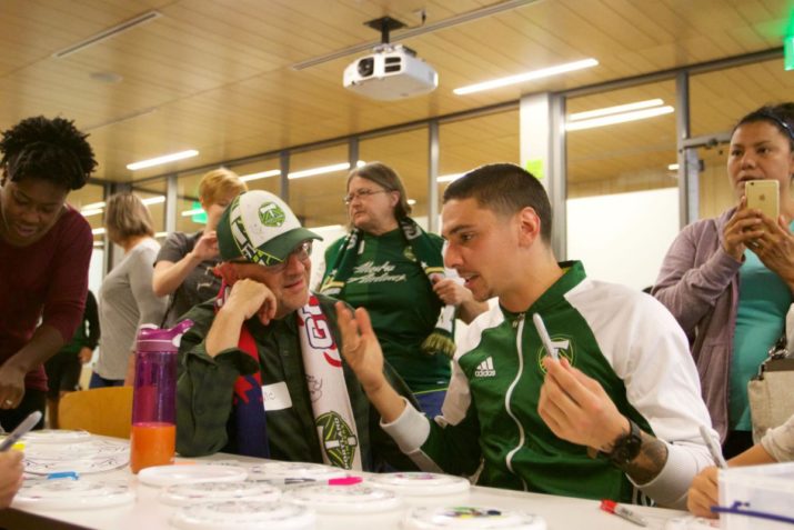 June 10, 2016; Portland, OR, USA; Timbers defender Zarek Valentin chats with volunteers following the Stand Together Week events at Hillsboro Library. Photo: Eric Cech-Portland Timbers