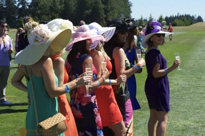 Lovely ladies show off their best polo garden party attire, complete with extravagant hats, during the Portland Monthly Champagne Divot Stomp on Championship Day. 