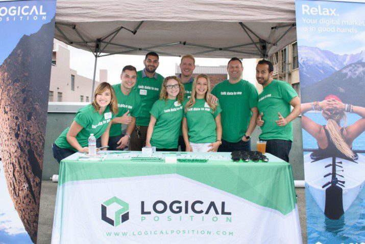 Employees from long time Rooftop Networking Party sponsor, Logical Position, pose in their booth.