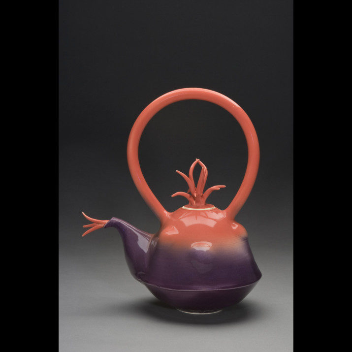 Hot Tea Medium: This piece is thrown in 2 parts + the spout. The handle is extruded. Body is altered. Glaze is sprayed. Artist: Gail Pendergrass