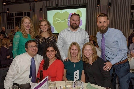 Guests at Bid Card and Travel Sponsor First Tech Federal Credit Union gather for a photo in the beautiful Exchange Ballroom. Back row, from left: Heidi Hodges, Margaret Harvison, Justin Valley, and Scott Brascum. Front row, from left: Casey Maharg, Nicole Frisch, Meghan Valley, and Anne Milligan.