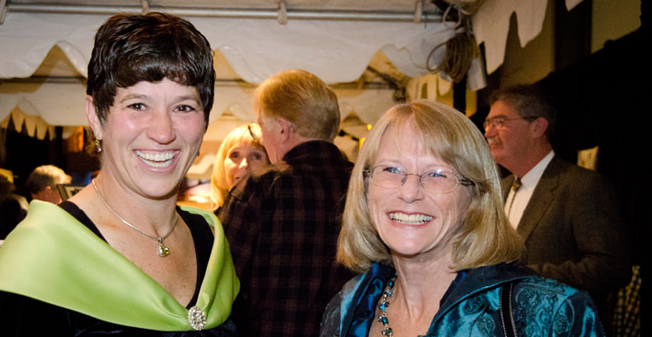 Karla Wenzel, chair of the Oregon Food Bank Board of Directors, checks out silent auction with Rachel Bristol, CEO, Oregon Food Bank.