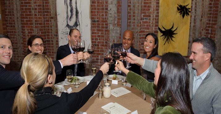 Guests give a toast at Irving Street Kitchen.