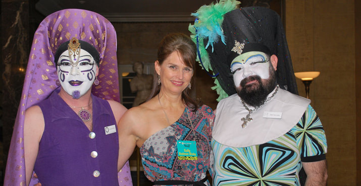 Development Director Sally Dadmun Bixby is framed by Sister Reva Lation and Sister Spinna DeVinyl