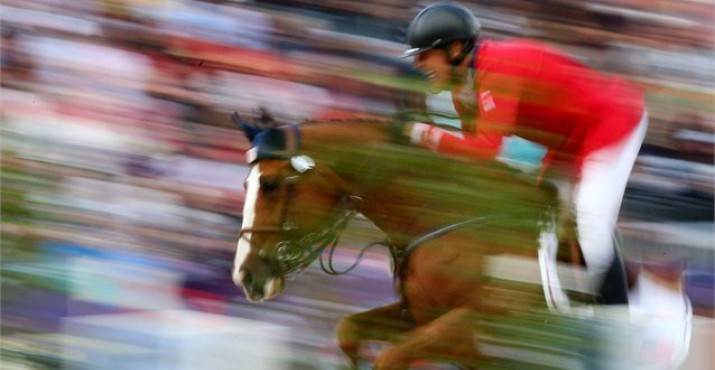 Richard Fellers of the United States riding Flexible competes in the first qualifier of Individual Jumping on Day 8.