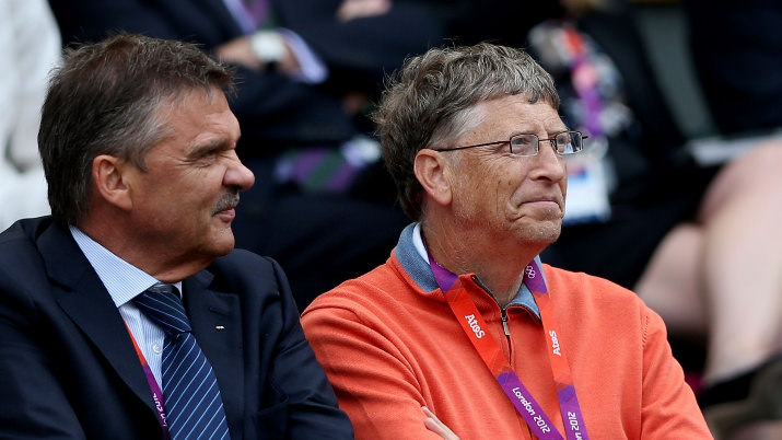 Microsoft chairman Bill Gates (R) watches Roger Federer take on Juan Martin Del Potro of Argentina in their epic Singles Tennis semi-final on Day 7 at Wimbledon. Federer eventually won the match 3-6, 7-6, 19-17.