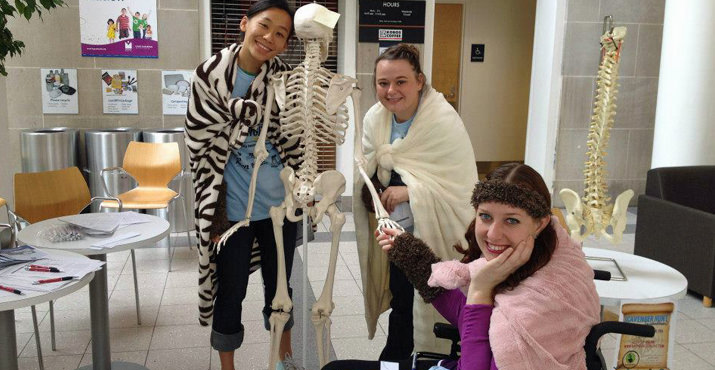 Participants learning about the spinal cord at Rehabilitation Institute of Oregon