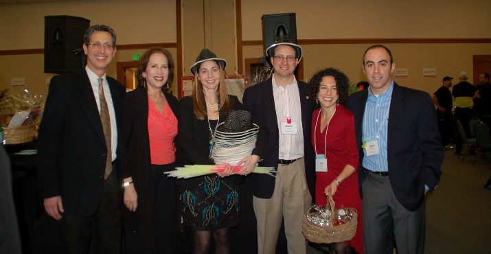 Rabbi Michael Z. Cahana and Cantor Ida Rae Cahana join event co-chairs Tiffany and David Goldwyn and Ali and Judah Garfinkle as they prepare to welcome guests to the second annual Taste of Temple, which was held at Congregation Beth Israel.