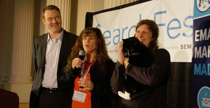 Mike Rosenberg, SEMpdx Board President, Kathy Covey, Cat Adoption Team (CAT) PR Manager/CATnip Race Director and Aisha Beck, CAT Volunteer address SearchFest crowd to help get “Candy Cane” and five other cats adopted using social media.