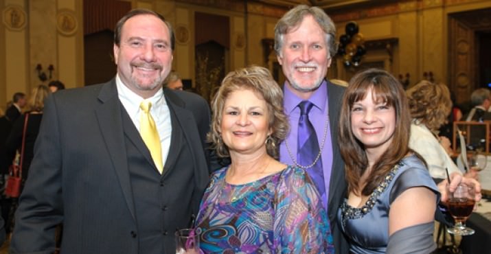 Thomas Edison High School supporter Scott Gardner, Debbie Maguire, school director Pat Maguire, and MaryLynn Gardner enjoy the silent auction at the Brilliance Benefit.