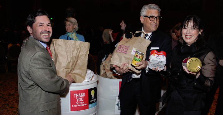 Marc Blattner, CEO of Jewish Federation of Greater Portland helped Festival co-chairs (and first cousins) Cheryl Tonkin and Ed Tonkin fill barrels donations for the Oregon Food Bank.