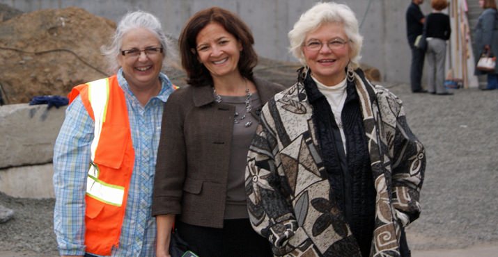 Pamela Kambur of Home Forward, Mari Yerger of Neighborhood House, and Harriet Cormack, Home Forward Board of Commissioners Chair, join guests as they tour the Children’s Center site.