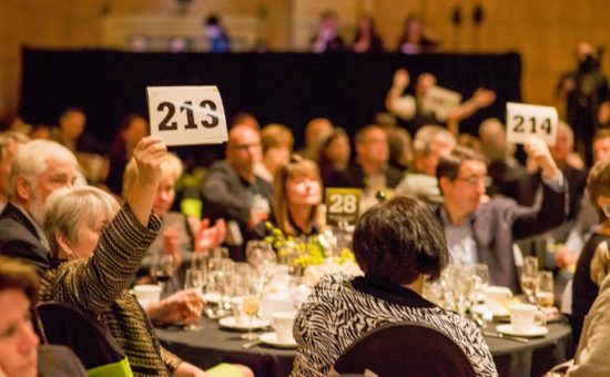 DoveLewis supporters raise their bidder numbers high during the evening’s appeal to support the nonprofit, 24-hour emergency animal hospital and community programs.