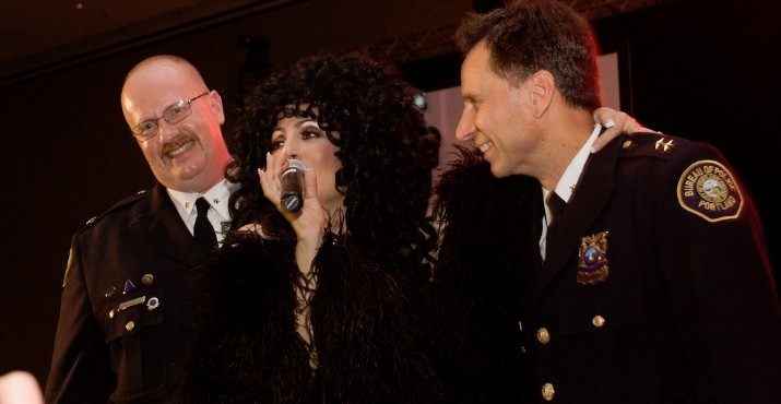 Cher loves a man in uniform. She came off stage to sing directly to Portland Police Chief Michael Reese and Assistant Chief Larry O'Dea