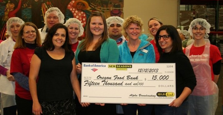 Nicole Frisch from Bank of America joined Cheona Philabaum and Whitney Krebs from New Seasons to present a $15,000 check to Sarah Schirmer on behalf of Oregon Food Bank.