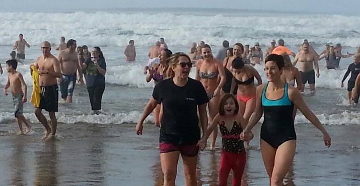 Before the plunge, hardy souls warmed themselves by the fire and took photographs. The first year, 2004, only 6 people took the polar plunge.