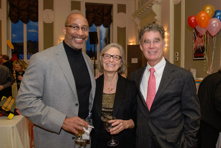 Charles Wilhoite, Mary Fellows, and John Russell enjoy the silent auction.