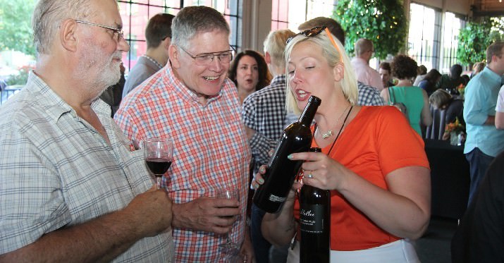 A sommelier pours a tasting of Owen Roe Union Gap Yakima Valley Malbec for event guests.