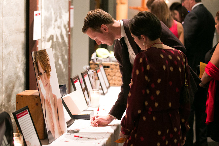 Devin and Leslie Nevius spent time marking their bids for the silent auction. 