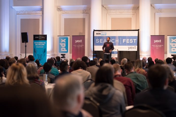A capacity crowd of nearly 500 attendees look on as Michael King delivers dynamic closing keynote at SearchFest.
