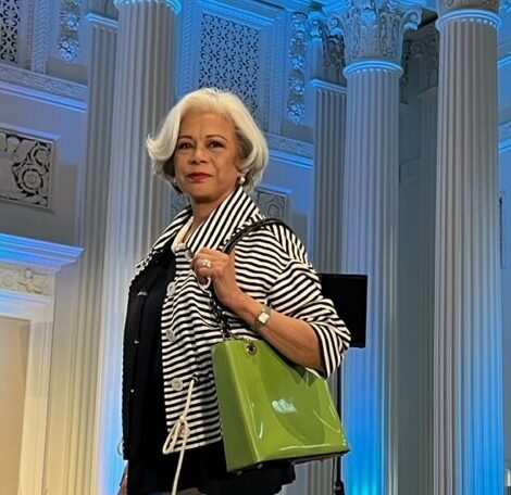 JoAnn Quilala, volunteer stylist for Assistance League, models an ensemble from Assistance League's Thrift Shop